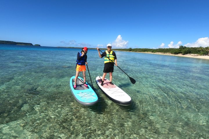 a person riding a surf board on a body of water